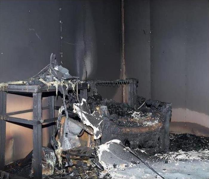 Fire damaged and soot-covered items in a home
