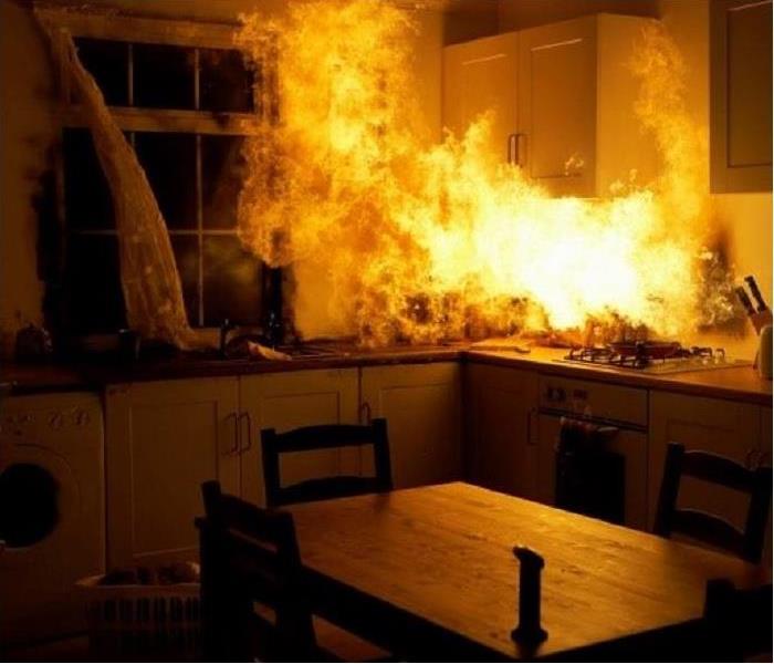 Growing blaze in kitchen