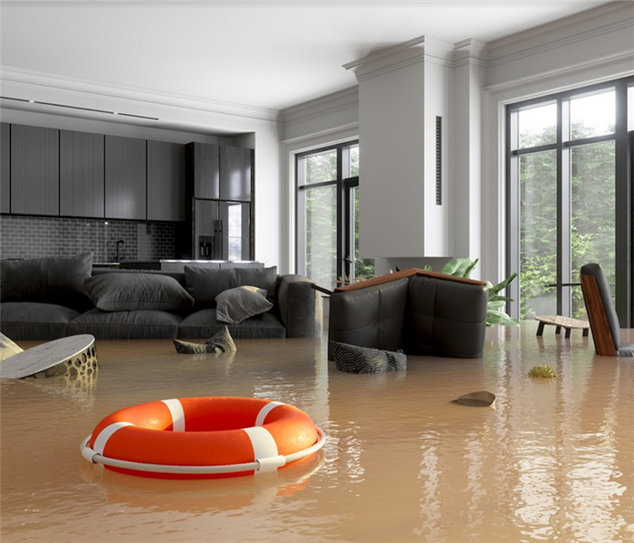 a flooded living room and kitchen with furniture floating around