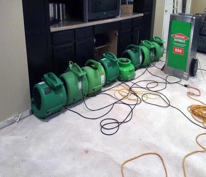 Our high-speed air movers and industrial-grade dehumidifiers working to dry this room